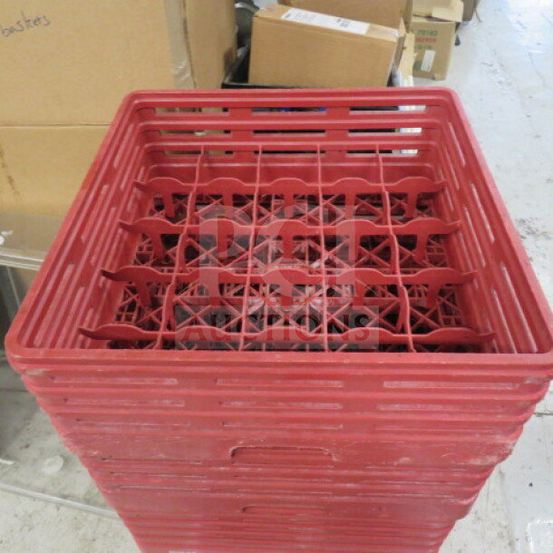 Red 25-hole dishwasher rack, model 2XBID, stacked and in good condition, ideal for organizing kitchenware.