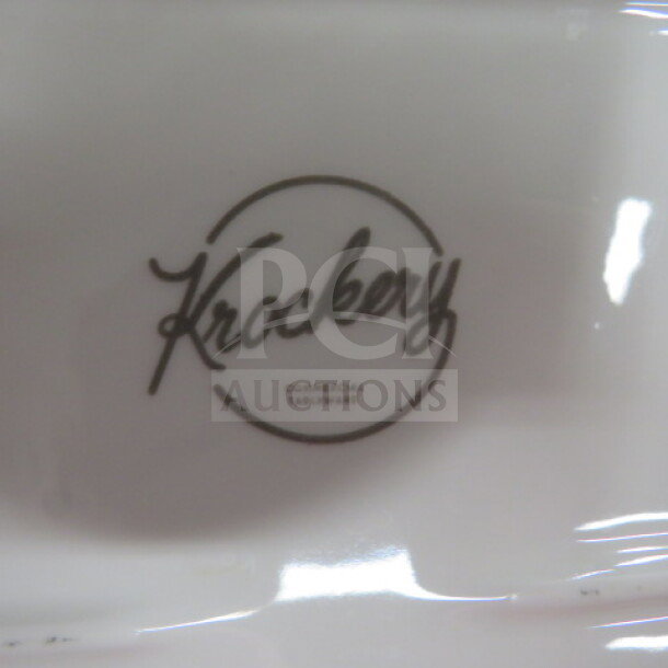 Krockery 14.5x6 plate with logo, pristine condition. Commercial tableware, ideal for elegant dining settings.