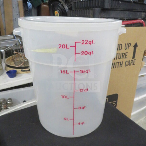 22-quart round food storage container with lid, clear plastic, red measurement markings in quarts and liters, excellent condition.