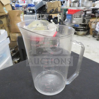 2 Quart Poly Measurer, clear with handle, red measurement markings, used condition, some wear visible.