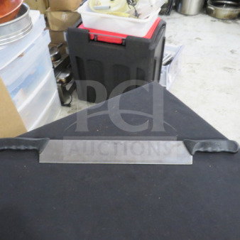 Double handle knife with stainless steel blade and black ergonomic grips. Appears in good condition on a black surface.