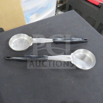 Two stainless steel 4oz spoodles with black plastic handles, in used condition. Ideal for portion control.