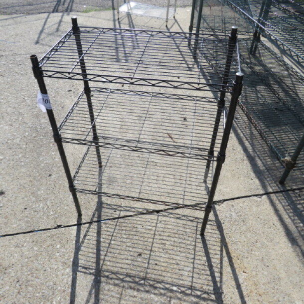Black Metro shelf unit with three wire shelves, 23.5x13.5x31 inches, mint condition. Ideal for storage and organization.