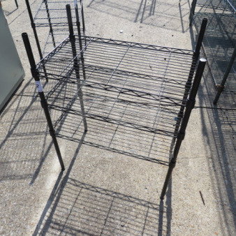 Black Metro shelf with three wire shelves, dimensions 23.5x13.5x31 inches, good condition.