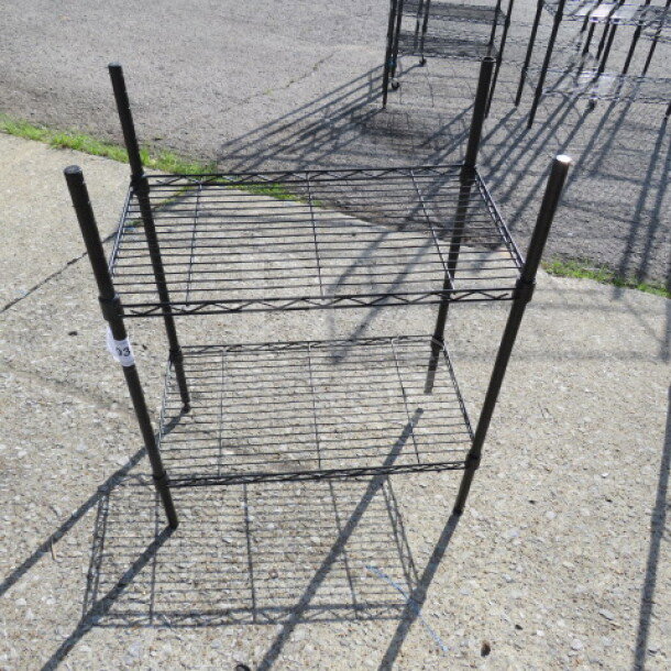 Black Metro shelf with two wire shelves, measuring 23.5x13.5x31 inches. Good condition, sturdy metal frame.