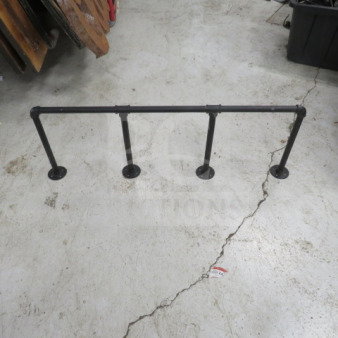 Black industrial pipe decor/waitress rail, 41x14.5 inches. Features sturdy metal pipes with flanges, in good condition.