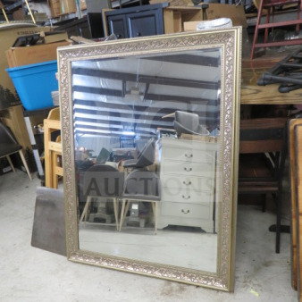 43x55 inch gold framed mirror with ornate detailing, rectangular shape, in good condition. Ideal for decor or practical use.