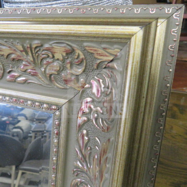 Gold framed mirror, 43x55 inches, ornate design with intricate floral patterns, excellent condition.