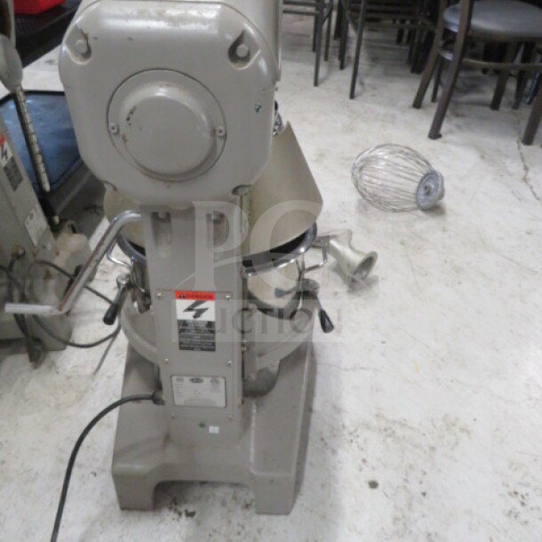 One Globe SP20 20 Qt Stand Mixer with stainless steel bowl, paddle, and guard. Model SP20, 110V. Condition: Used.