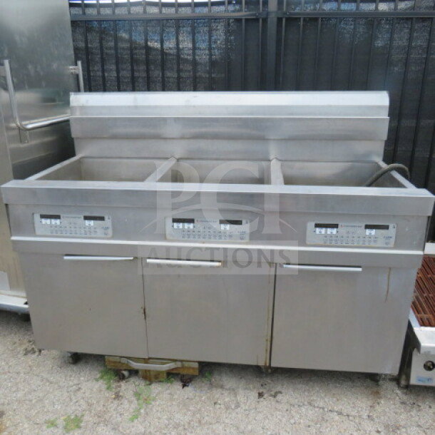 Frymaster 3-bay natural gas fryer, model 31814NFSE, with digital controls and filtration, on casters. Measures 60x33.5x48 inches.