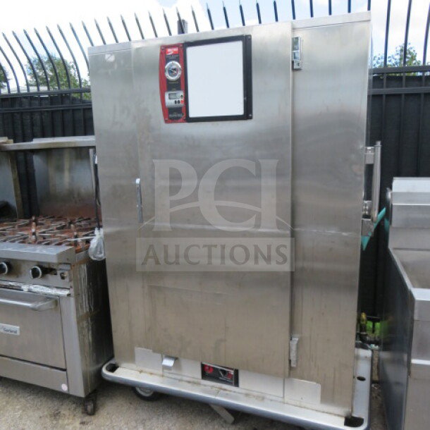 Metro BQ1700 heated holding cabinet with one door, stainless steel, on casters, used condition, labeled controls visible.