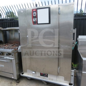 Metro BQ1700 heated holding cabinet with one door, stainless steel, on casters, used condition, labeled controls visible.
