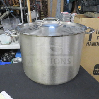 Stainless steel 40qt stock pot with lid, dual handles, metallic finish, in good condition. Ideal for large-scale cooking.