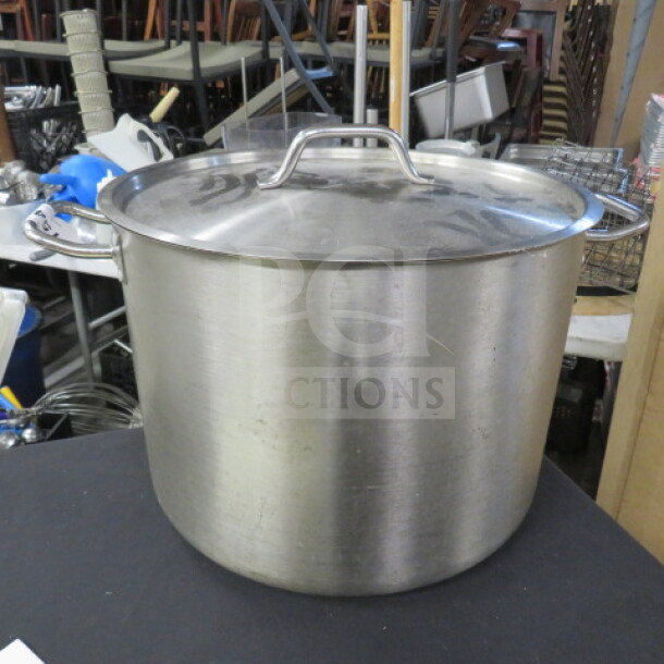 Stainless steel 40qt stock pot with lid, model SST-40. Features sturdy handles; ideal for large-scale cooking.