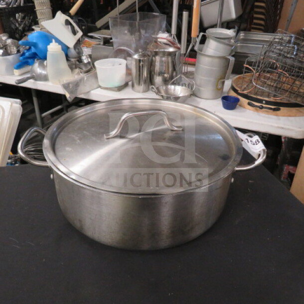 Stainless steel 15qt brazier pot with lid, model SSLB-15. Features sturdy handles, in good condition.