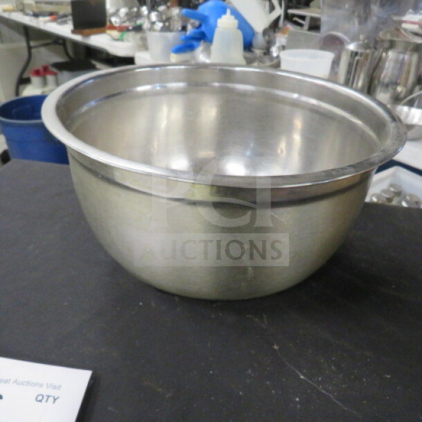 12x6.5 stainless steel mixing bowl, polished finish, gently used condition, no visible dents or scratches.