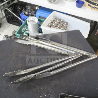 Stainless steel tongs, 12 inches, in good condition, with scalloped edges for grip. Model: 3XBID.