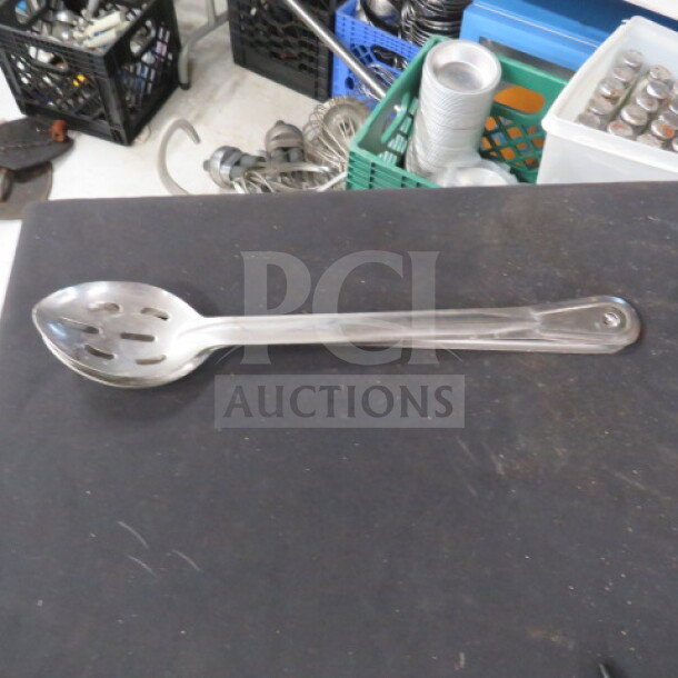 Commercial long handle slotted spoon, stainless steel, excellent condition. Ideal for heavy-duty kitchen use. Model 3XBID.