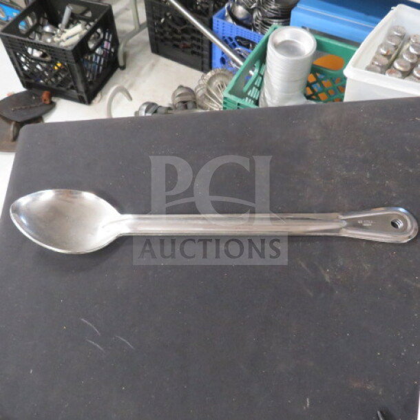 Stainless steel long handle spoon, model 3XBID. Features durable, polished finish, ideal for deep pots. Appears gently used.