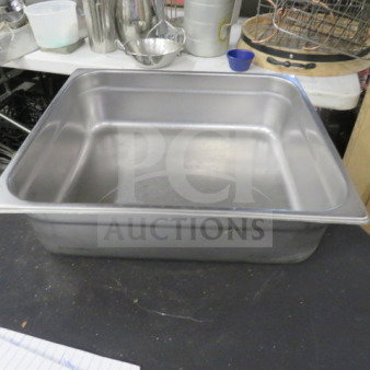 3/4 Size 4 Inch Deep Hotel Pan, stainless steel, used, ideal for catering or food service, visible slight wear.