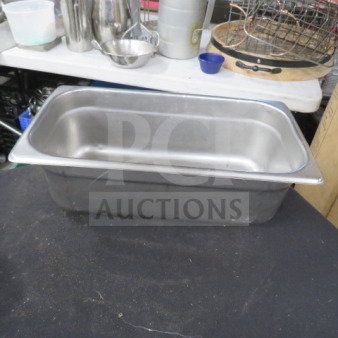 1/3 size stainless steel hotel pan, 4-inch deep. Used condition. Ideal for catering or commercial kitchens.