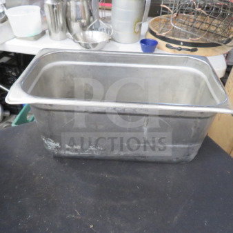 1/3 size hotel pan, 6-inch deep, stainless steel, visible wear, ideal for catering or food service needs.
