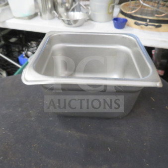 1/6 size 4-inch deep hotel pan, stainless steel, used condition. Ideal for commercial kitchen use.