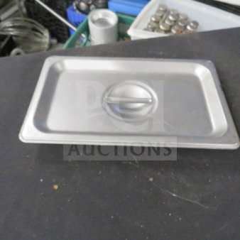 1/4 Size Stainless Steel Lid with handle, in good condition. Marking "5XBID" visible. Suitable for commercial use.
