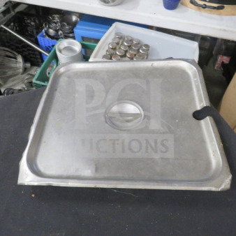 3/4 Size Stainless Steel Lid, model 2XBID, featuring a center handle. In used condition with visible scratches.