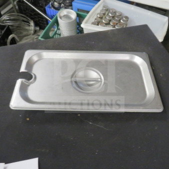 1/3 Size Stainless Steel Lid with handle, utensil notch. Lightly used condition, ideal for commercial kitchen use.