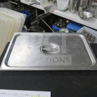 Stainless steel full-size lid, model 4XBID, with center handle. Good condition. Ideal for commercial kitchen use.