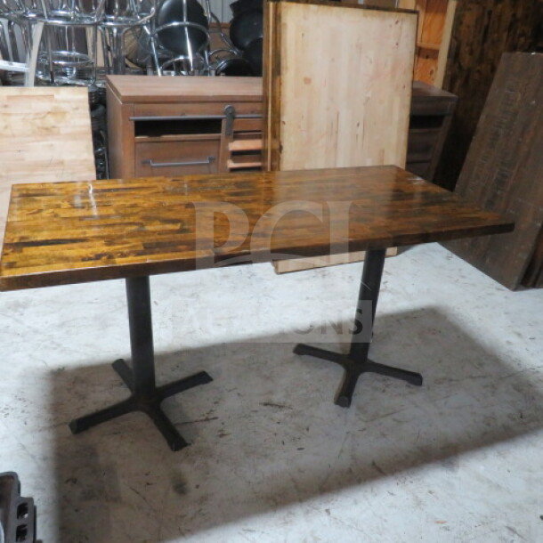 Solid wood butcher block table top, 1.5-inch thick, dual pedestal base, dimensions 81x32x30 inches, in good condition.