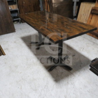 Solid wood butcher block table top, 1.5" thick, on dual pedestal base. Dimensions: 72x36x30 inches. Rustic finish.