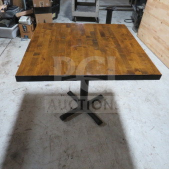 Solid wood butcher block table top on pedestal base, 1.5" thick, 42"x32"x30", natural finish, excellent condition.