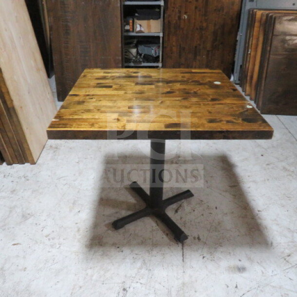 Solid wood butcher block table top, 1-1/2" thick, on sturdy pedestal base, 30"x30"x30", excellent condition.
