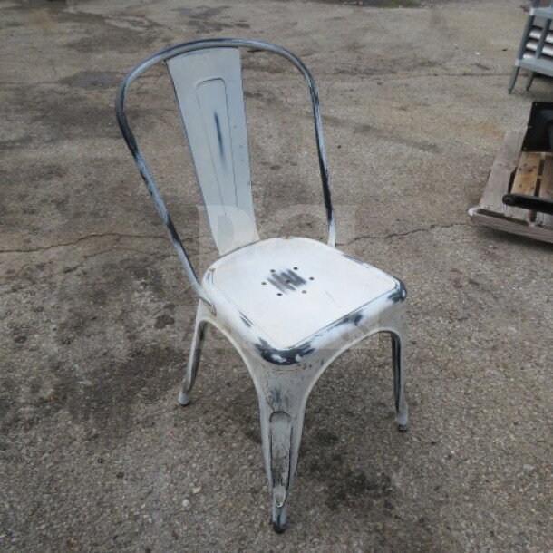 Vintage white-washed industrial metal chair, worn finish, curved backrest, sturdy design, model 4XBID.