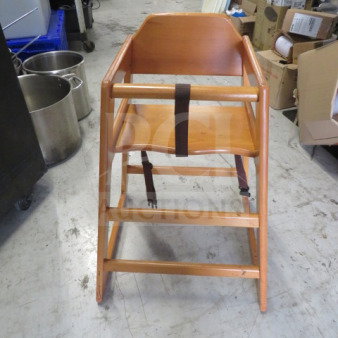 One light oak wooden high chair with safety straps, excellent condition, sturdy design, ideal for baby or toddler use.