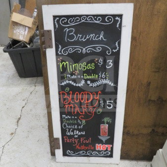 White wooden framed chalkboard, 16x36 inches, with colorful brunch menu text and prices. Good condition.