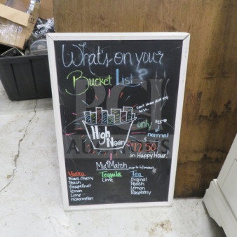One 20x30 white wooden framed chalkboard with colorful writing and a bucket list theme, in good condition.