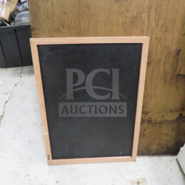 Wooden framed chalkboard, 17x23 inches. Simple design, good condition. Perfect for home or business use.