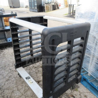 Rubbermaid 1/2 size pan rack on casters, 30x23x36 inches, durable plastic, used condition.