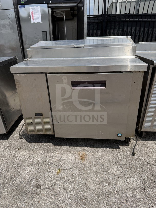 Hoshizaki Model PR46A prep table, 1 door, 2 racks, casters, 115V, 46x33x44 inches, working condition, stainless steel.