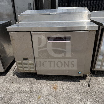 Hoshizaki Model PR46A prep table, 1 door, 2 racks, casters, 115V, 46x33x44 inches, working condition, stainless steel.