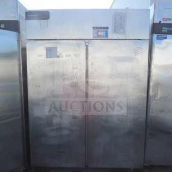 Delfield 2-Door Refrigerator, Model GBR2PS, with 8 racks, on casters. Dimensions: 55x32.5x79.5 inches. 115 Volt. Slight wear.