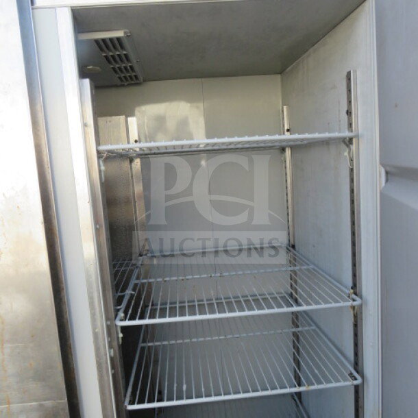Delfield 2-Door Refrigerator GBR2PS, 8 racks, on casters. Measures 55"x32.5"x79.5". 115V. Used, good condition.