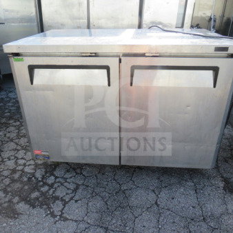 Turbo Air MUF-48N 2-door worktop freezer with 2 racks, on casters, stainless steel, measures 48x30x35 inches, good condition.