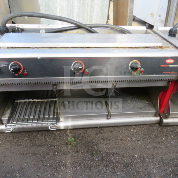 Hatco Thermo Finisher model TFWM36-6900, 36"x18"x17.5", 208V, 1-phase; stainless steel with control dials and open shelf.