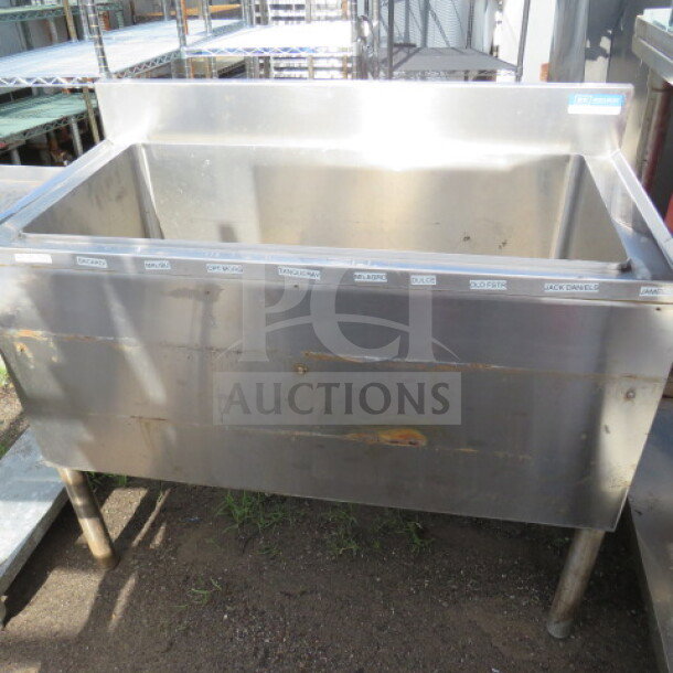 BK Stainless Steel Ice Well, Model UB4-18-IBCP36, 36x18x32.5 inches. Used condition with visible wear and labels on top edge.
