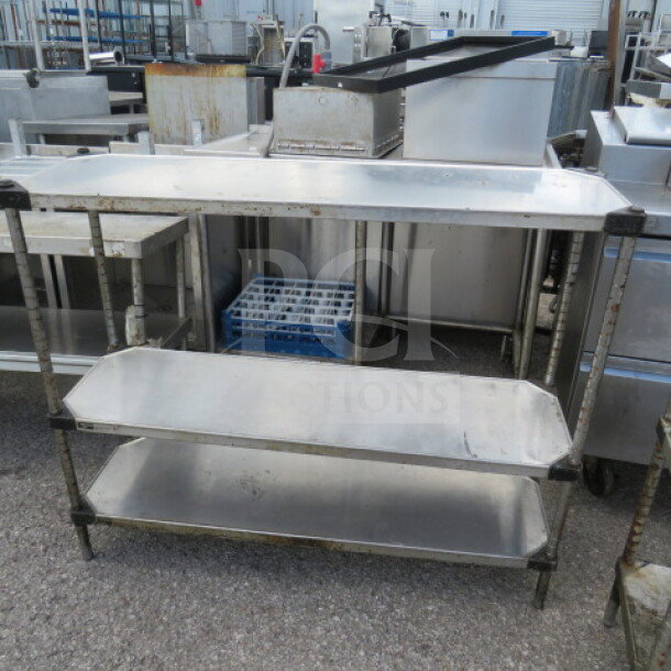 Metro shelving unit with three stainless steel solid shelves, dimensions 48x14x40.5 inches. Used condition.
