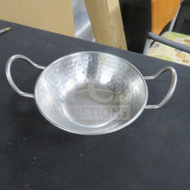 Stainless steel hammered bowl, 5.5 inches, with side handles. Item code 10XBID, priced at $7.79 each.